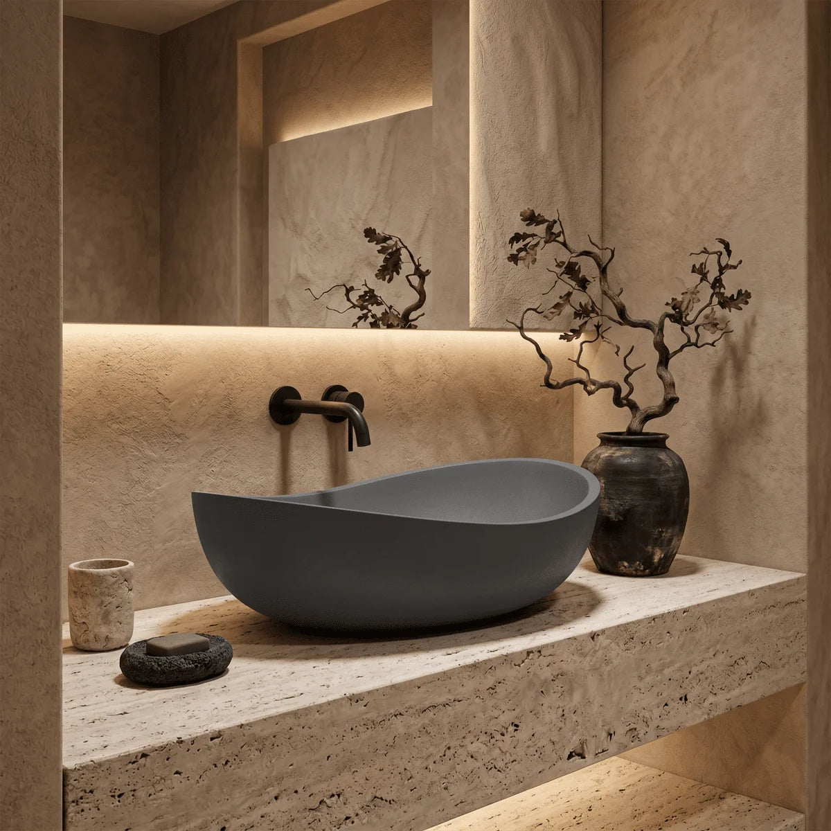 Lavabo gris sobre una encimera en un baño